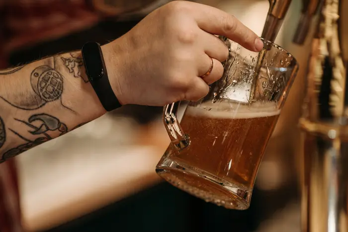 Beer being poured at a bar